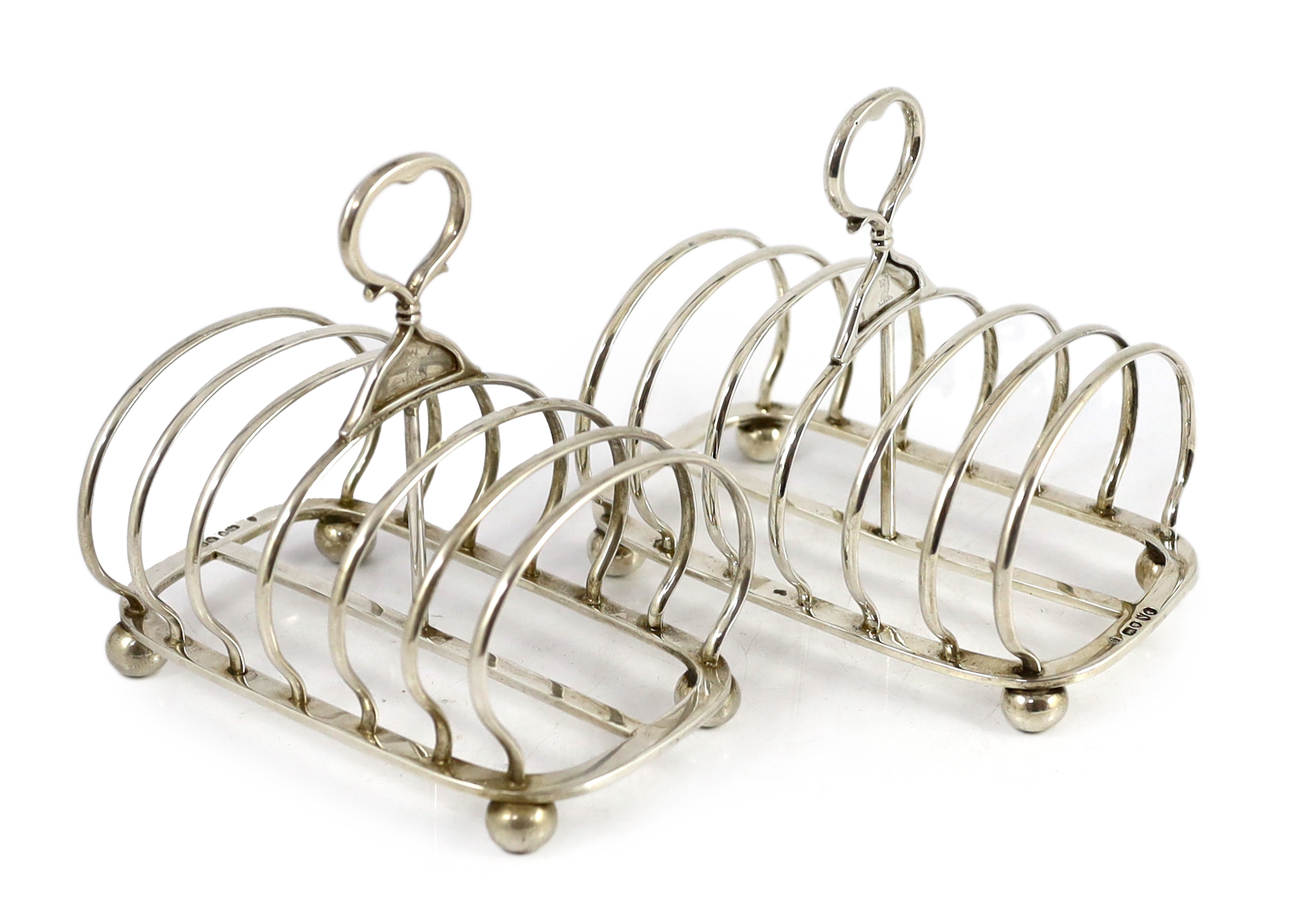 A pair of late Victorian silver seven bar toast racks by John Samuel Hunt (Hunt & Roskell late Storr & Mortimer)